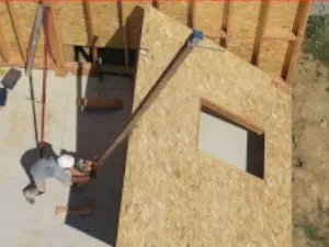 Pose des ossatures de mur avec un lève mur